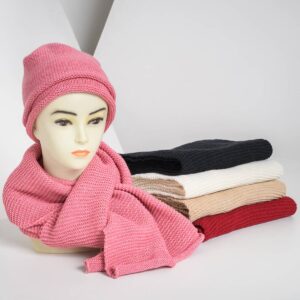 a woolen knitted hat with a scarf on a stand